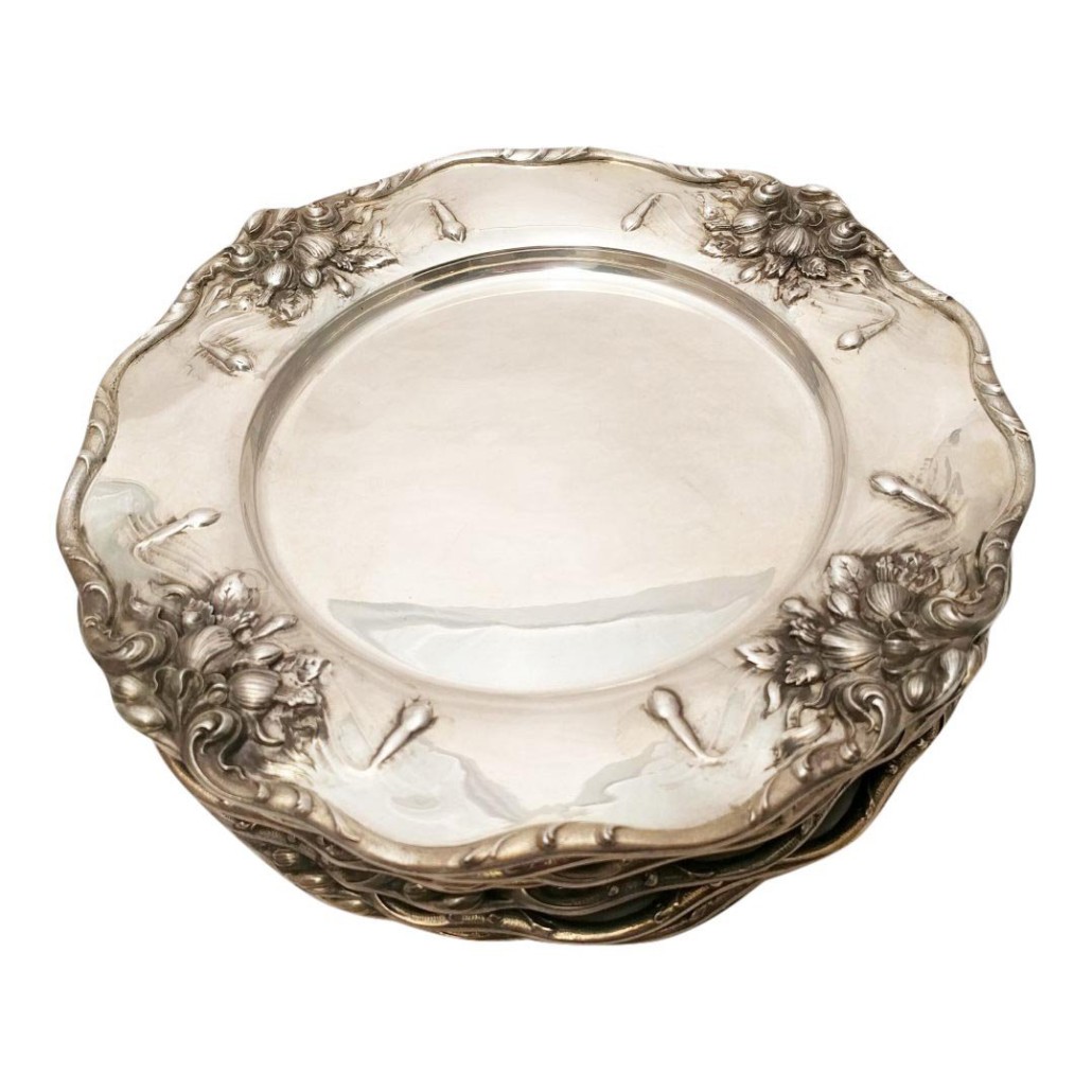 Set of eight Dominick & Haff sterling silver dinner plates in the Art Nouveau style, 1902, 10 1/4 inches in diameter, total weight 136 troy ounces. Estimate: $6,000-$8,000. Jasper 52 image