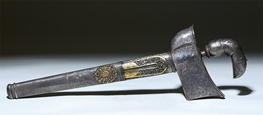 Mid-19th century Indonesian kris dagger with white sapphires, 18 inches long. Estimate: $2,700-$4,050.