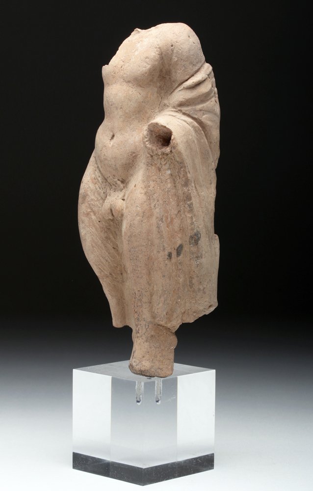 Hellenistic pottery fragment of Pan, Greece / Roman empire, circa third to second century B.C., hollow-molded statue, 6 3/4in on custom Lucite stand. Estimate: $500-$700. Artemis Gallery Live image