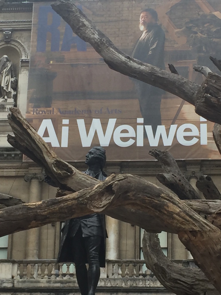 An image of Chinese artist Ai Wei Wei shares the Royal Academy courtyard with Sir Joshua Reynolds, first president of the Royal Academy of Arts. Image Auction Central News.