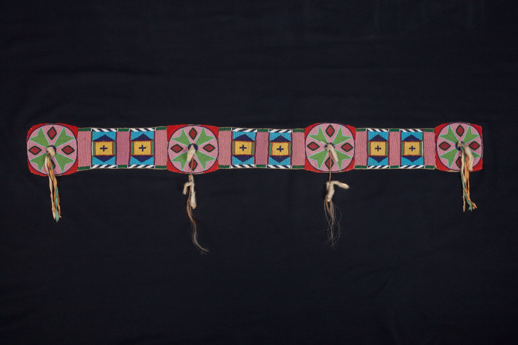 Plateau beaded hide blanket strip, circa 1885, navy blue and red wool trade cloth, blanket size: 63 1/2 x 54 inches; length of strip: 52 ½ inches. Estimate: $12,000-$18,000. Heritage Auctions image