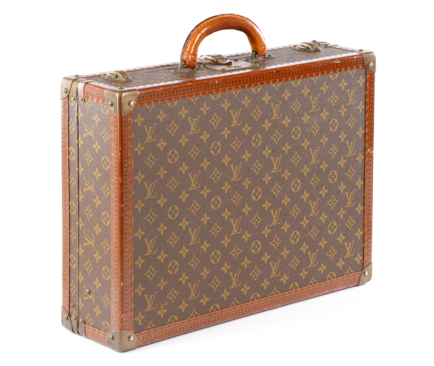 Early 20th century Louis Vuitton designer Alzer suitcase in signature tan monogram canvas with brass hardware. Ahlers & Ogletree image