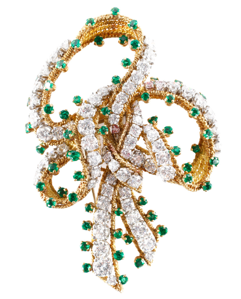Tiffany & Co. handmade 1930s platinum, 18K gold, diamond and emerald brooch of serpentine bow form. Ahlers & Ogletree image