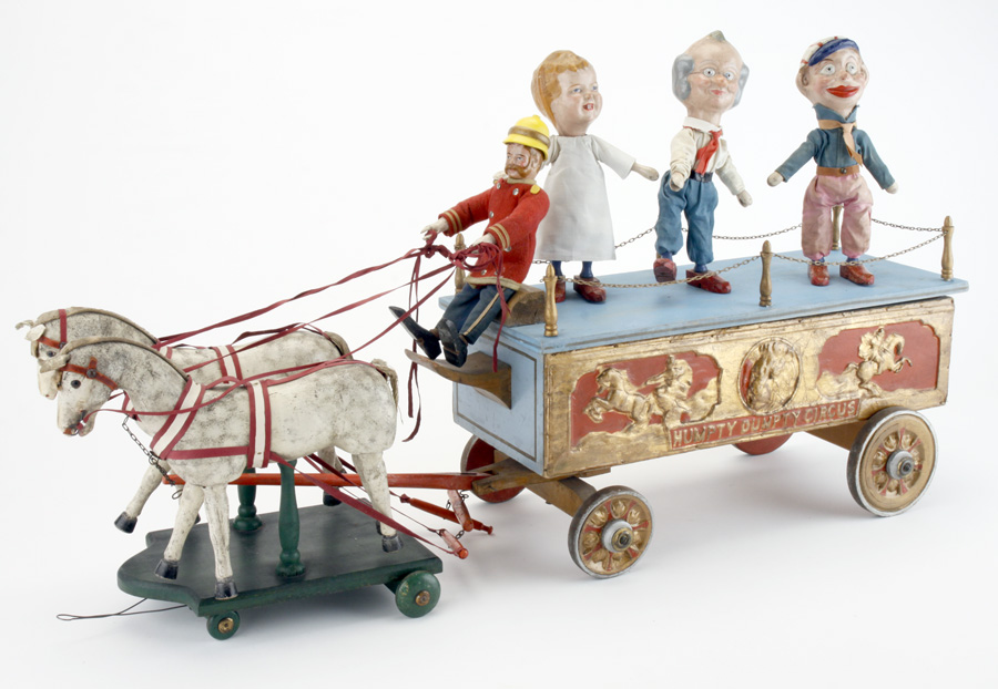 Schoenhut Grotesque Parade Wagon, 18 inches long with driver and three performer figures, est. $12,000-$15,000