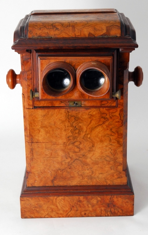 Large antique tabletop stereoscope with double viewers and assorted cards covering multiple themes, in a beautiful burl cabinet, 10 inches wide by 18 inches tall. The Specialists of the South Inc. image