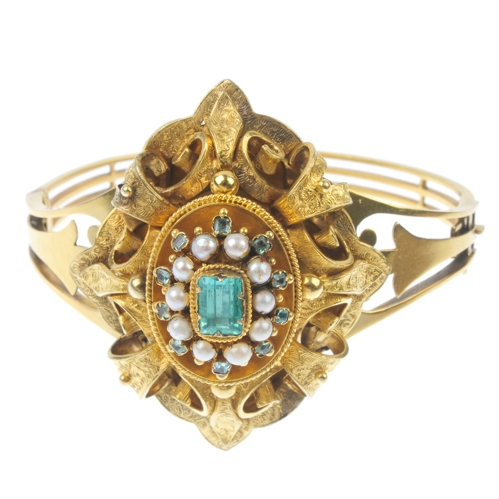 Lot 391 - foil-back emerald and seed pearl gold bangle, (est. £1,500 - £2,000). Fellows image 