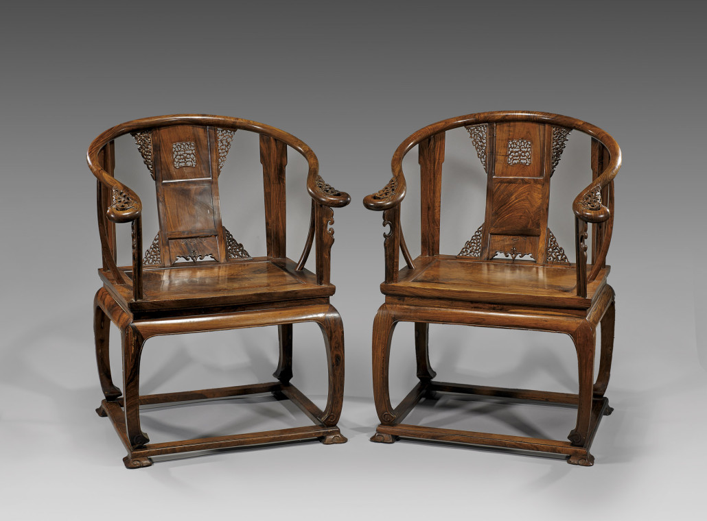 This antique pair of Chinese carved huanghuali wood armchairs with intricately carved backsplat and curvilinear arms ending in a scrolled flourish brought $43,760 at I.M. Chait in 2013. Courtesy I.M. Chait Auctioneers, Beverly Hills, Calif.