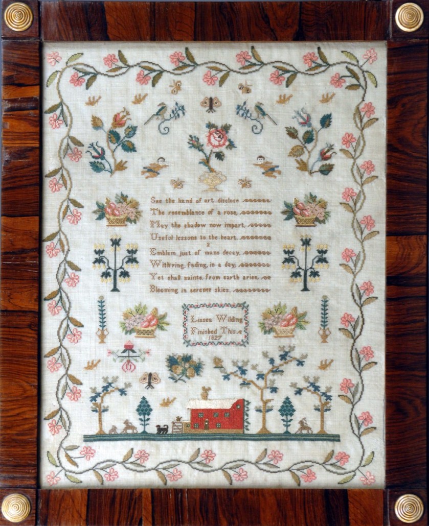 A George IV example worked with 'Lissee Wilding, finished this 1827,' which sold for £780. It shows a view of a farmhouse baskets of fruit, and flowers and an eight- line verse