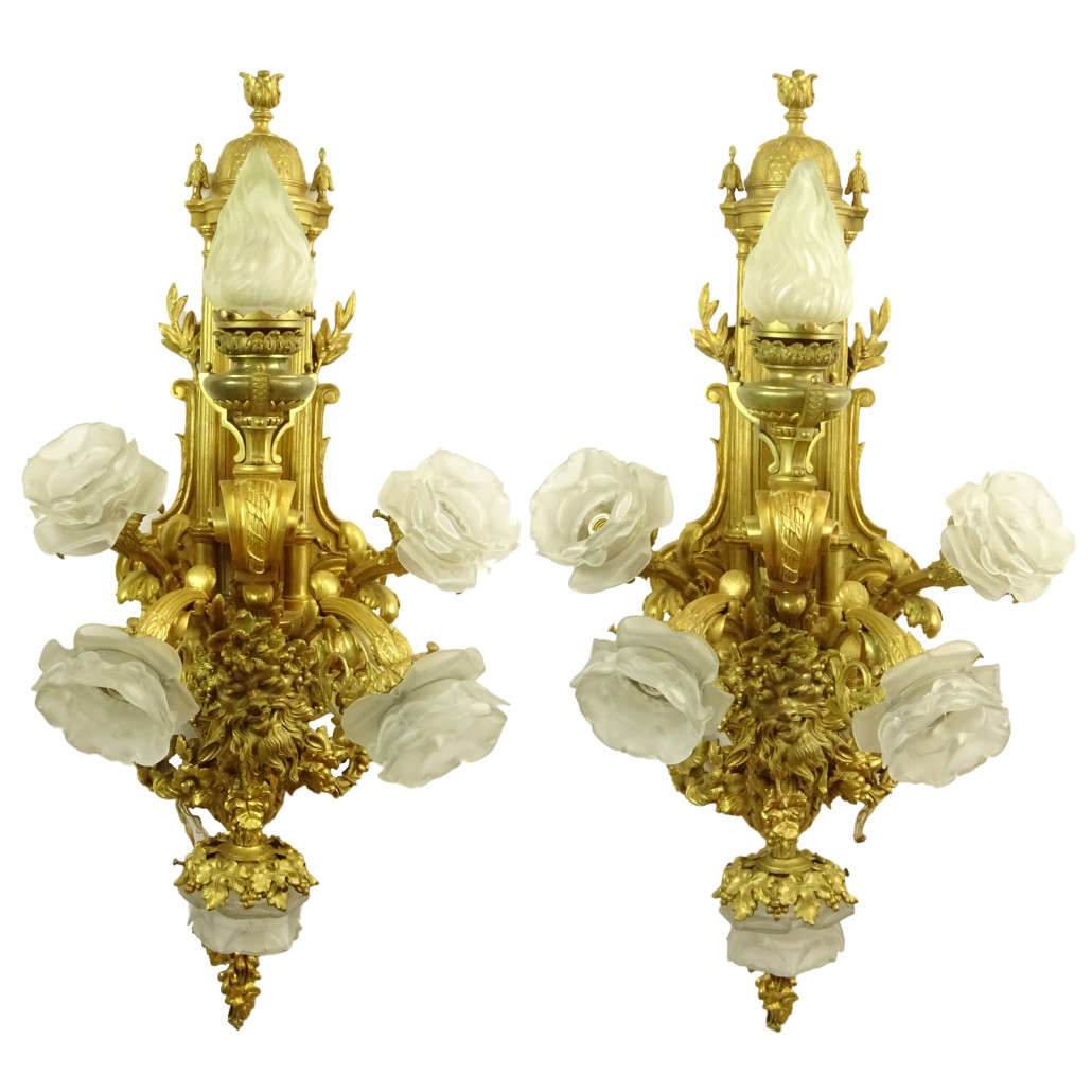 Pair of 19th century French gilt bronze sconces with finely cast relief Bacchus masks and grape leaf swags. Price realized: $7,260. Kodner Galleries image 