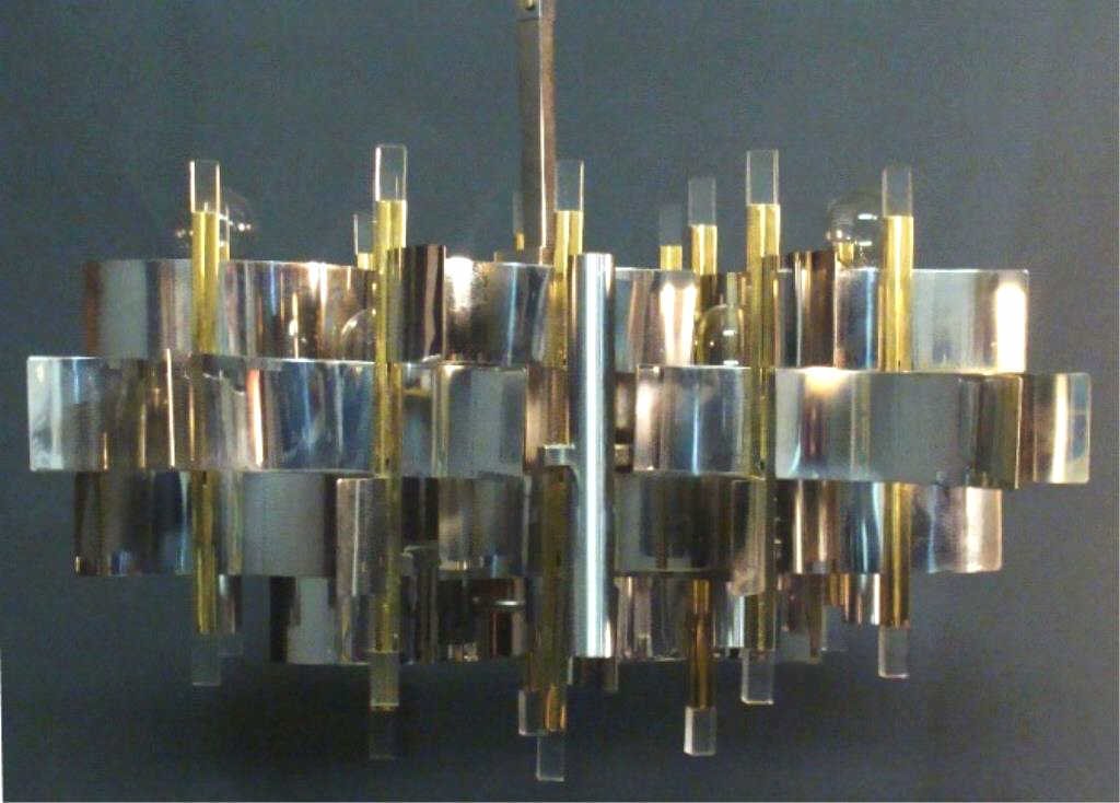 Lot 74 – Italian mid-century brass and chrome chandelier with Lucite accents, designed by Gaetano Sciolari, 36 x 24in. Estimate: $1,500–$2,000. Tonya A. Cameron Auctions image