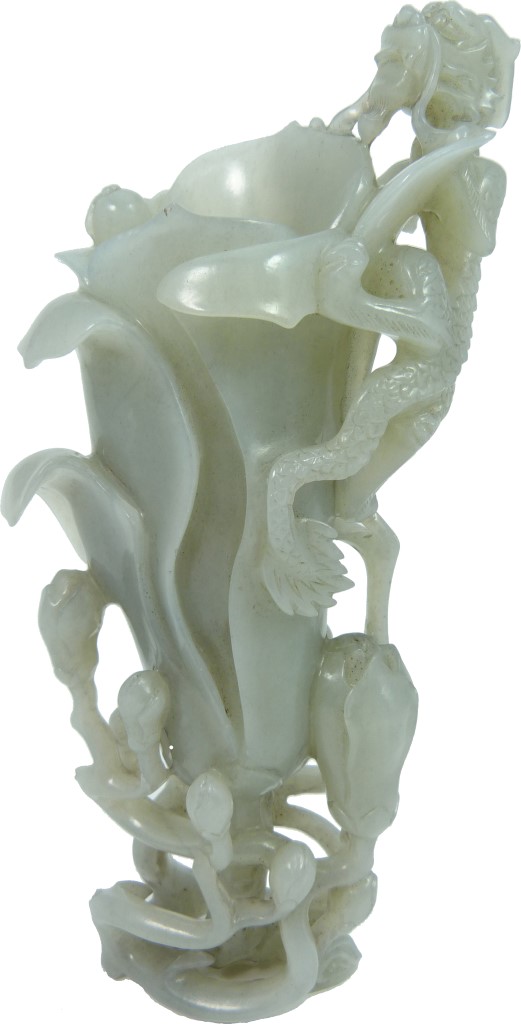 Lot 28 – Chinese jade magnolia with dragon vase carving, 6 1/4 inches tall. Estimate: $3,000-$4,500. Antiques & Modern Auction Gallery image