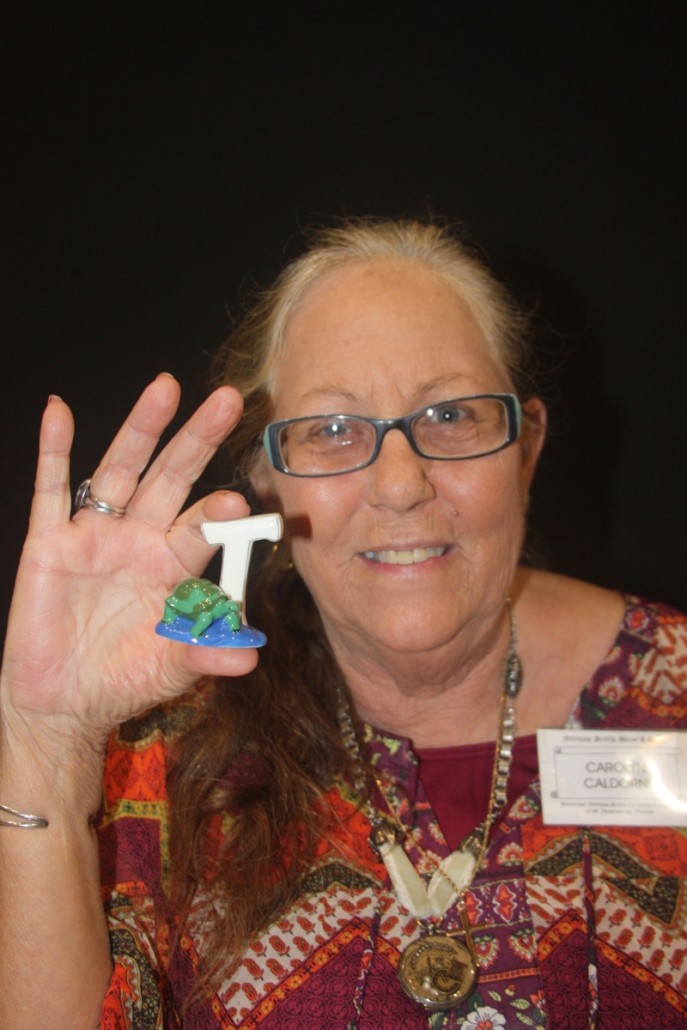 Carolyn Caldorni with a Whimsie alphabet figure, this one featuring a turtle and the letter 'T.' Photo author